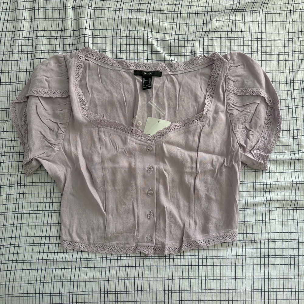 lilac purple lace top with puffy sleeves and button up front!